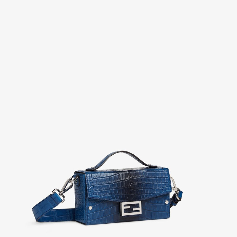 Soft Trunk Baguette bag made of exquisite matte crocodile leather in graduated blue tones. Flap with 2
