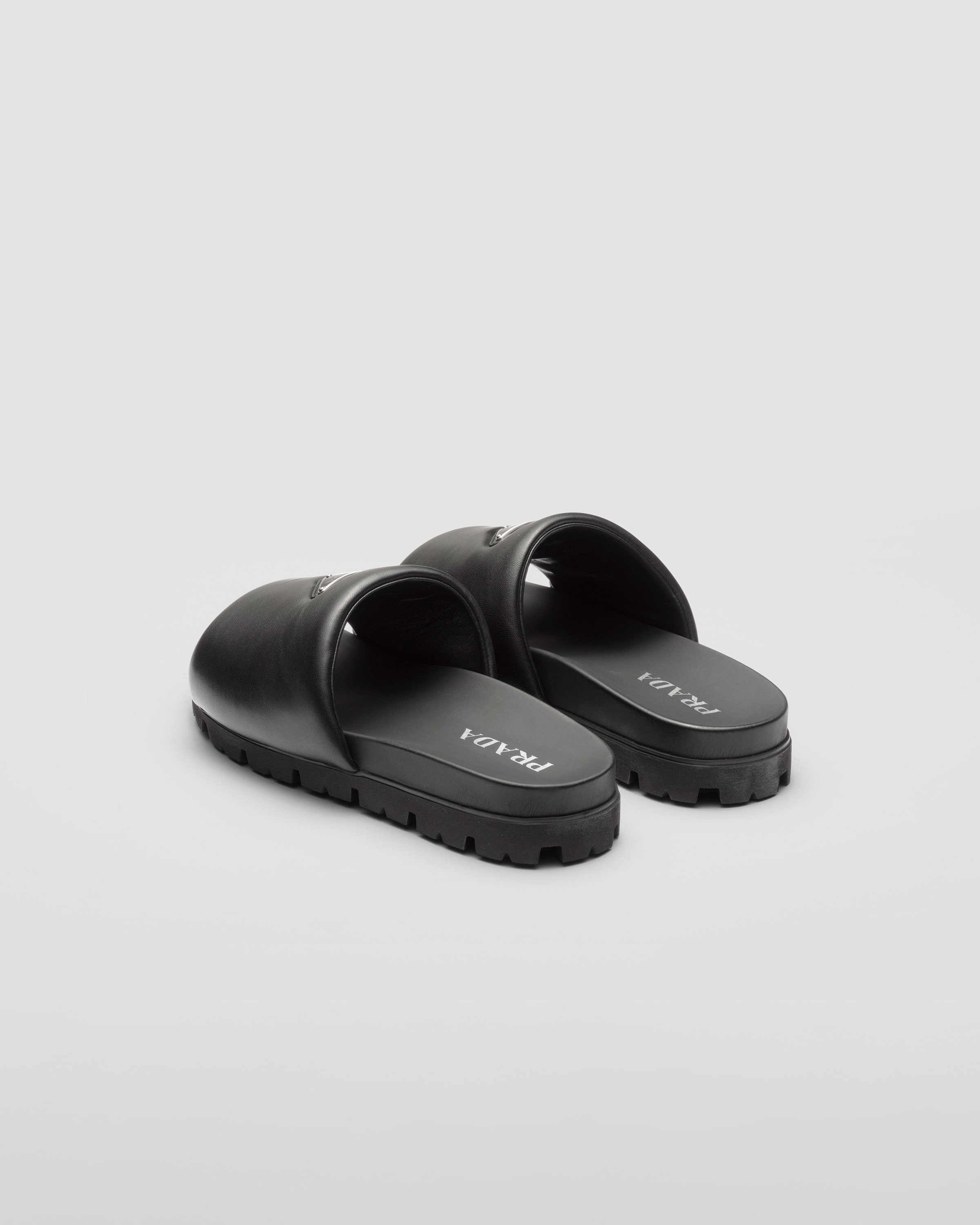 Prada Padded nappa leather slides | REVERSIBLE