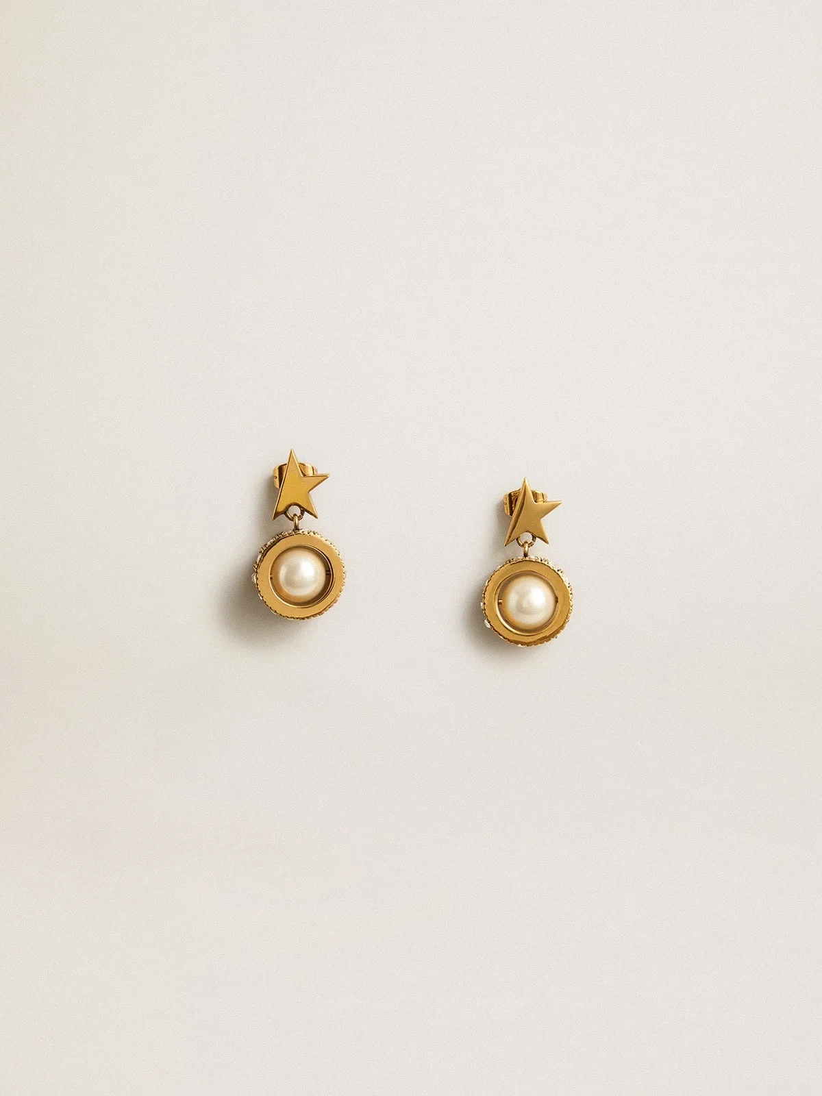 Earrings with gold star and pearl - 1
