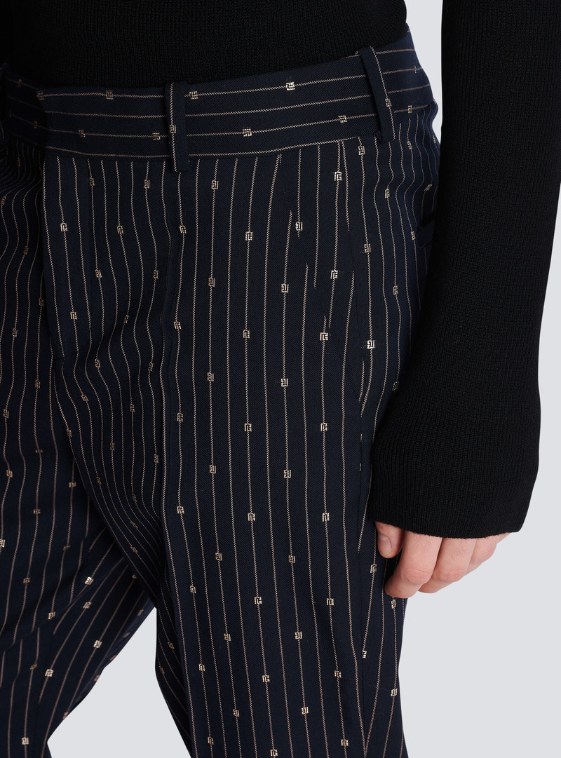 Monogrammed wool trousers with creases and thin stripes 7