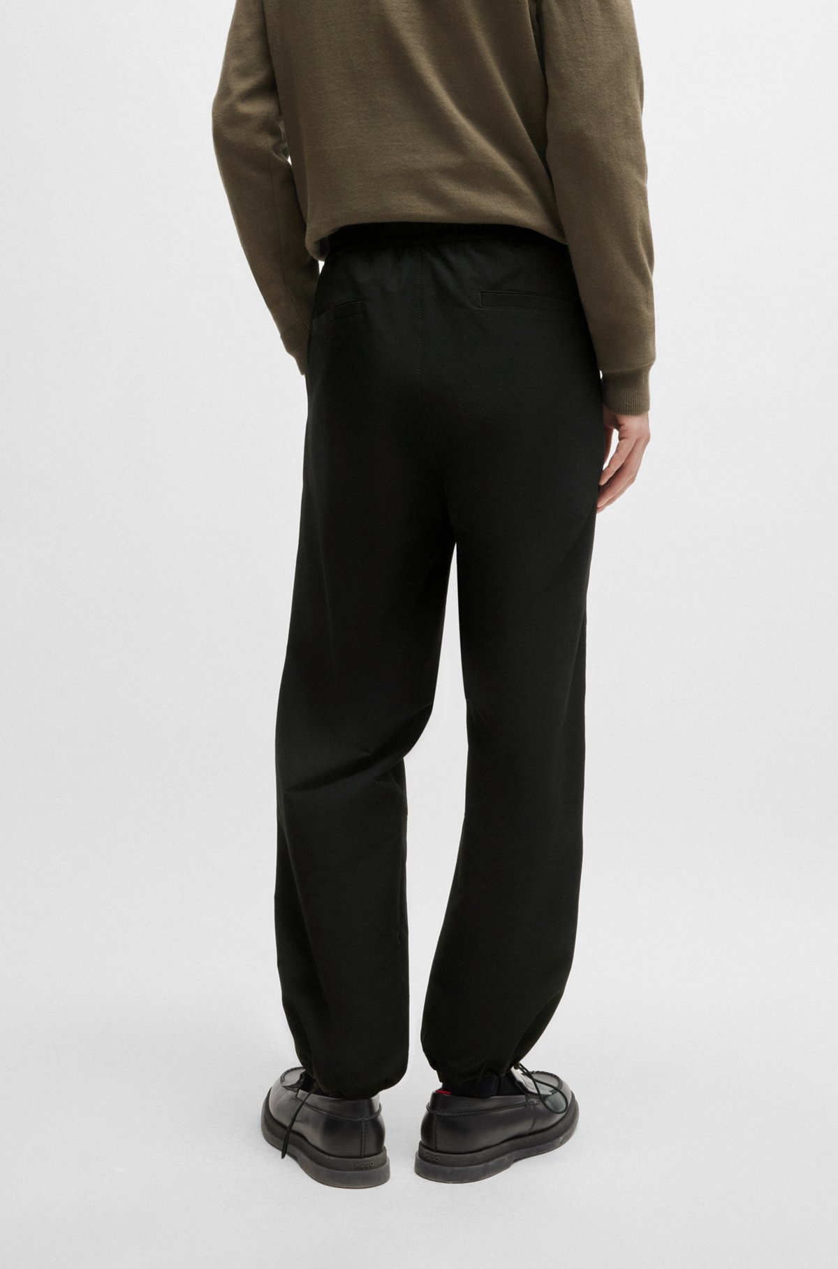 WATER-REPELLENT TROUSERS WITH ADJUSTABLE HEMS - 4