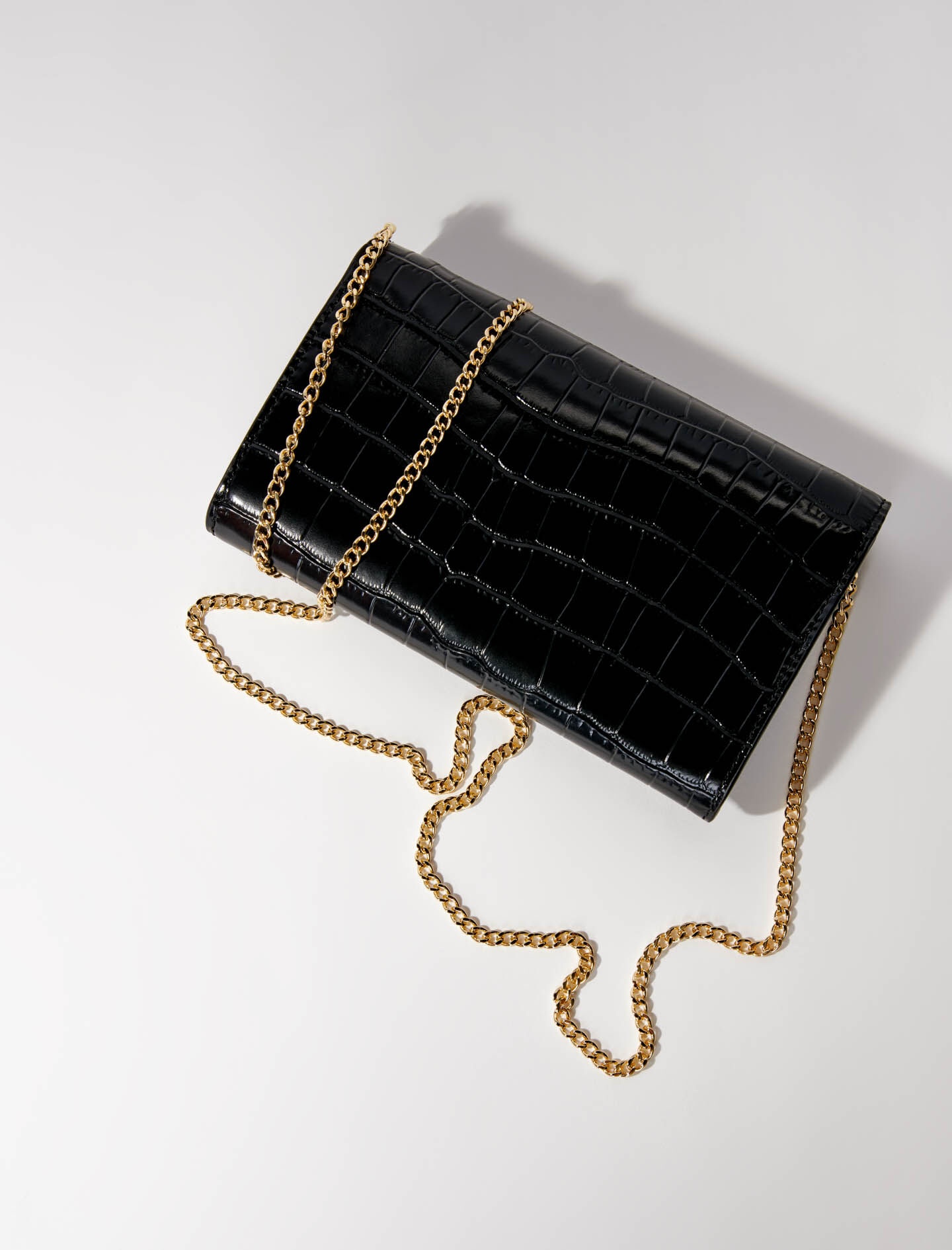 Croc-effect embossed leather bag 4