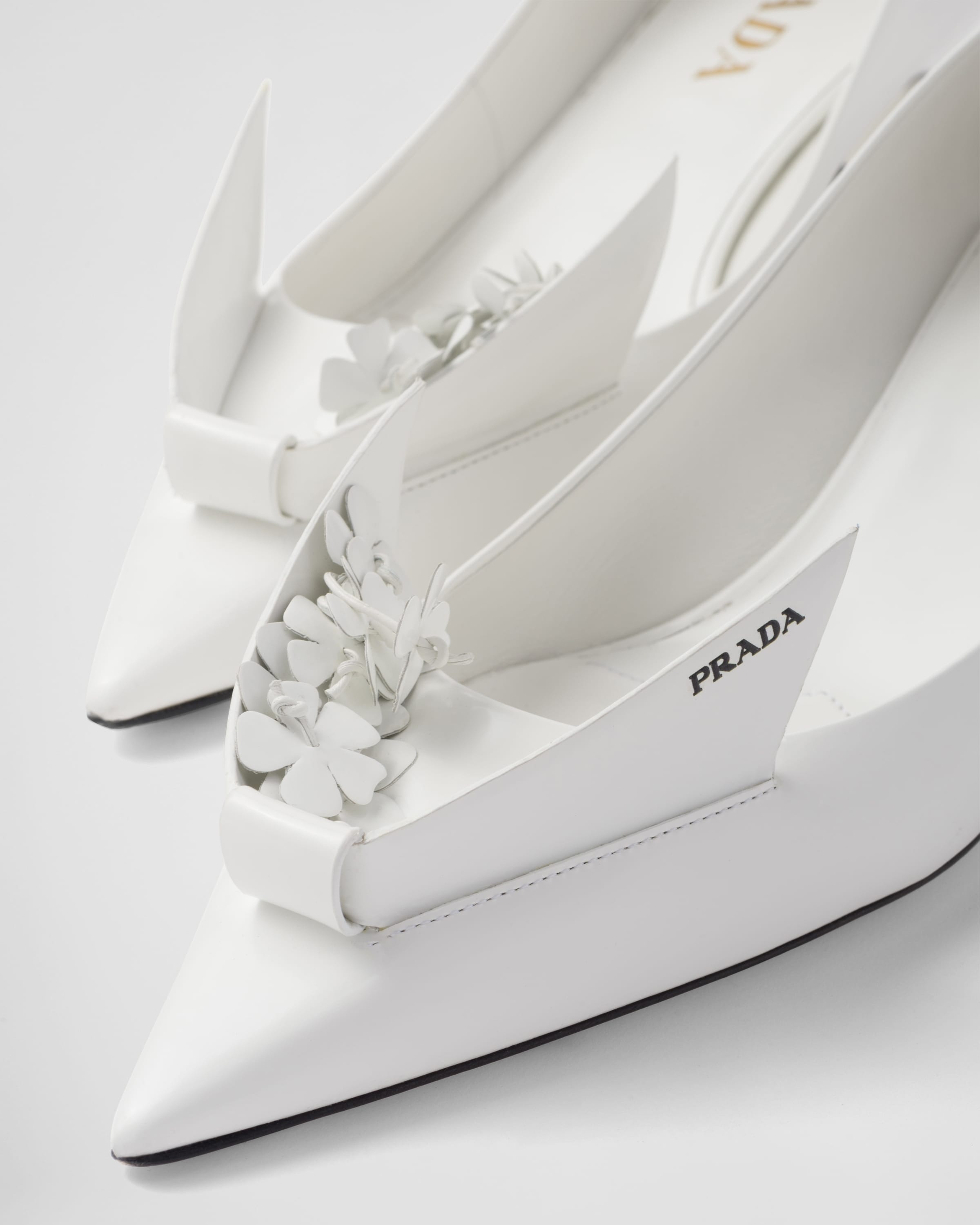 Brushed leather pumps with floral appliqués - 6