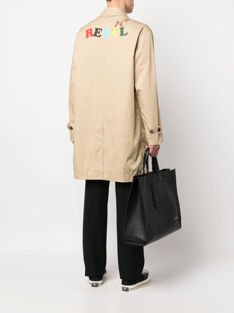 UNDERCOVER slogan-print gabardine trench coat outlook