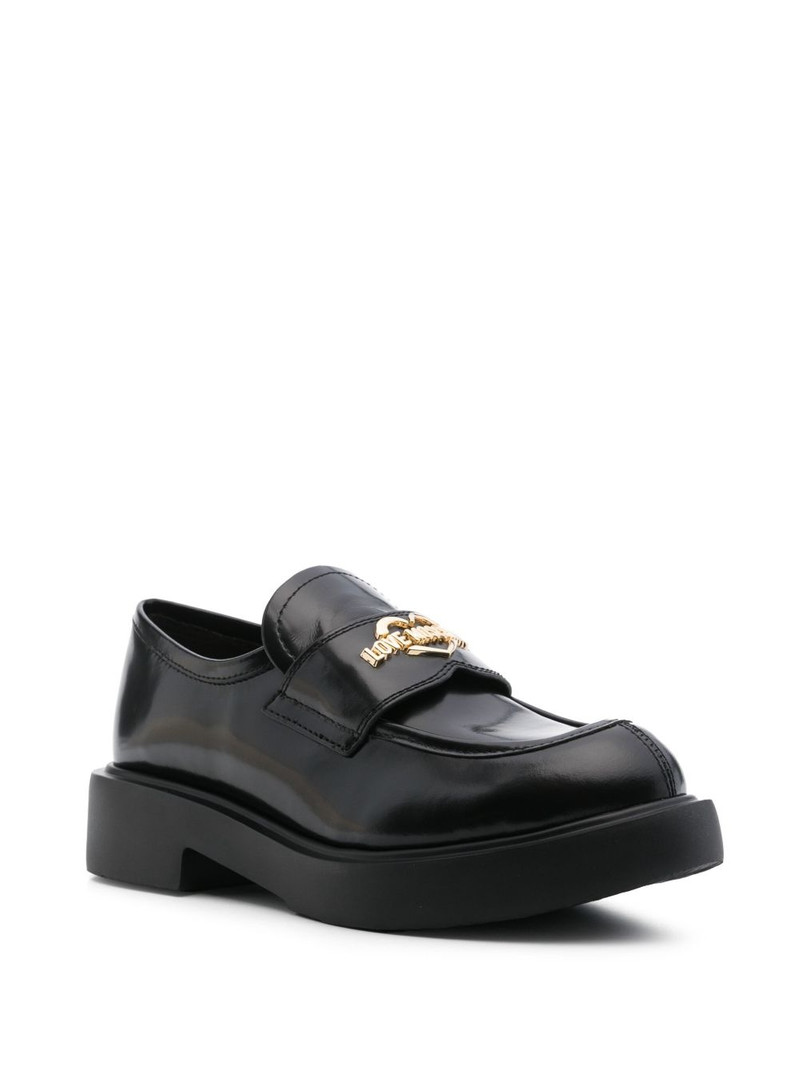 Moschino logo-plaque loafers outlook