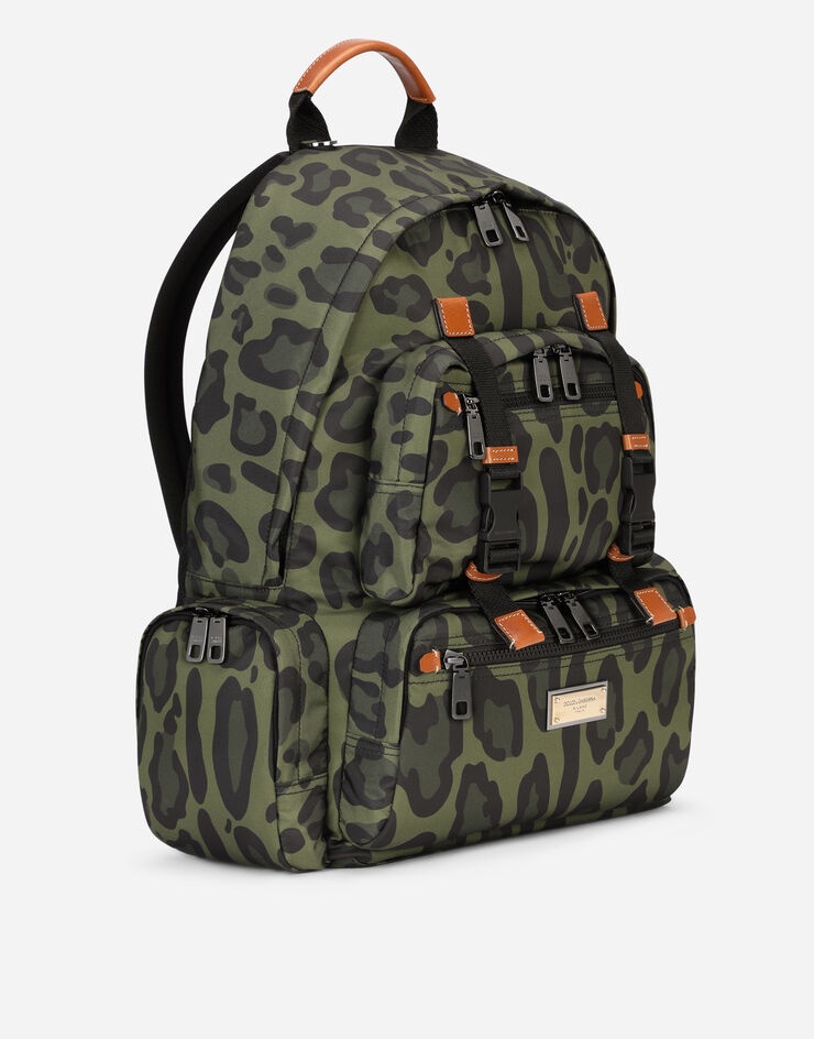 Nylon backpack with leopard print against a green background and branded plate - 3