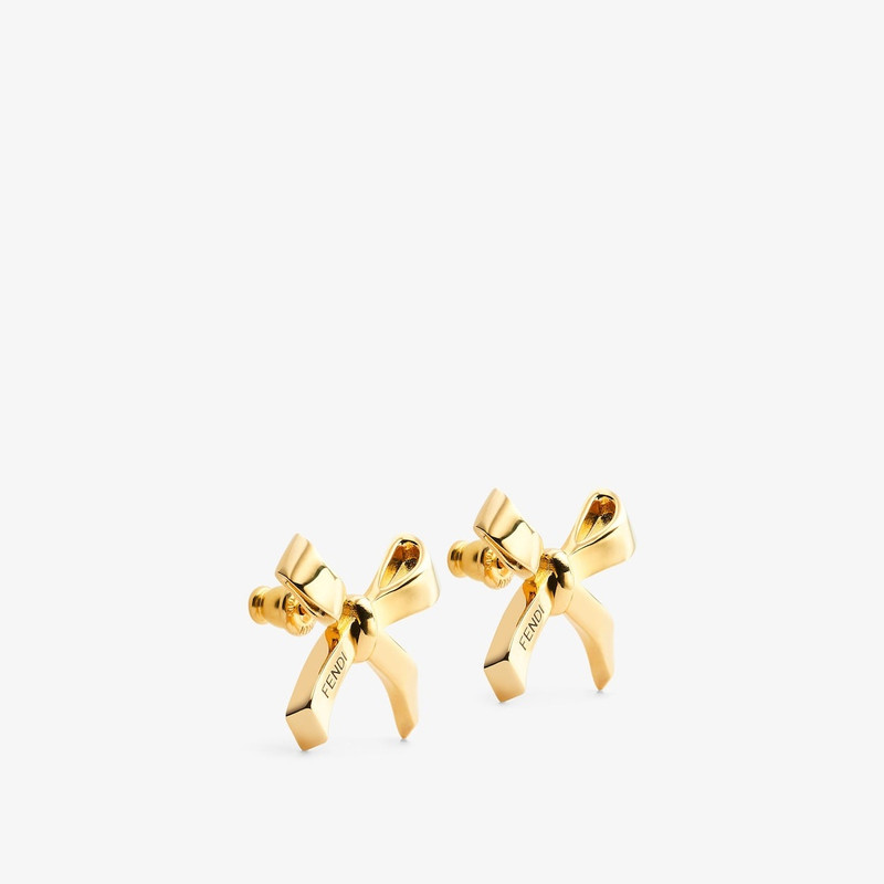 FENDI Bow-shaped earrings. Made of metal with a gold finish. Decorated with Fendi lettering enameled in bl outlook