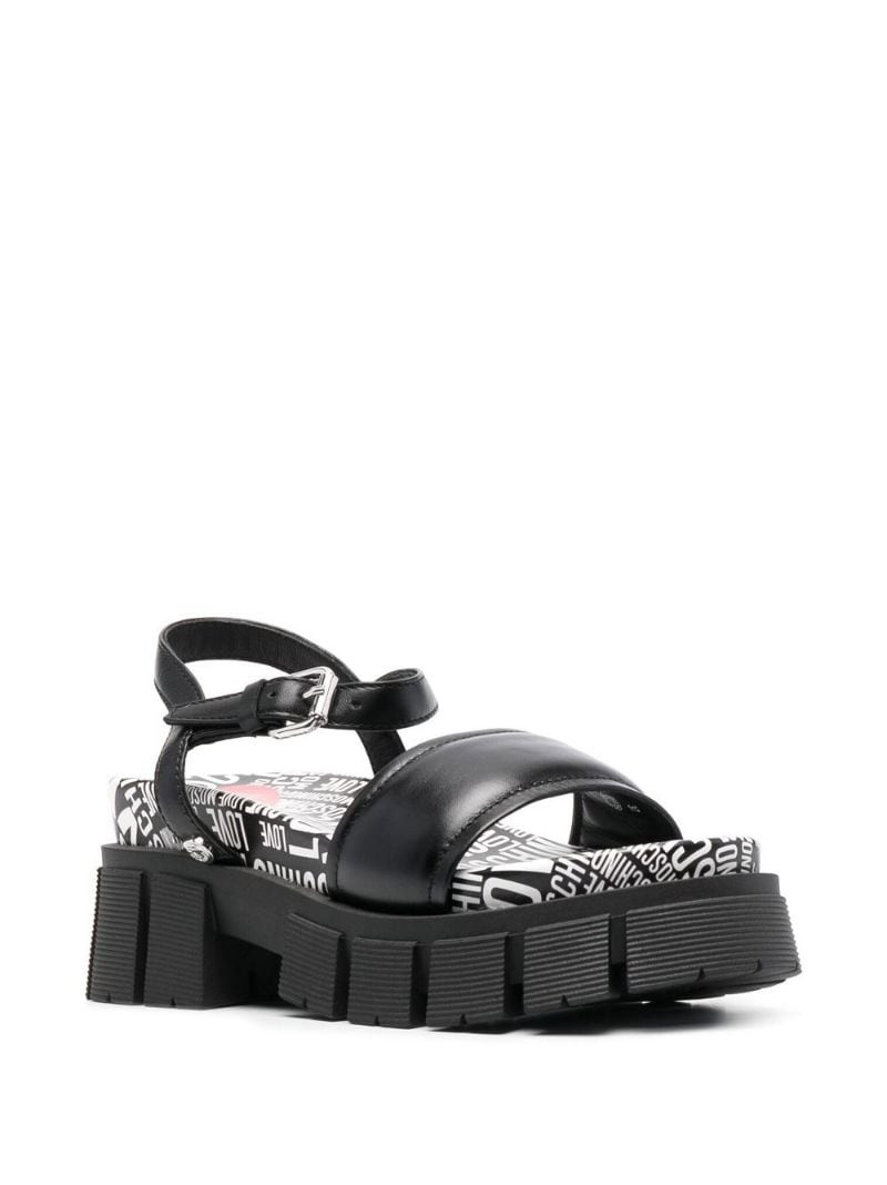 Moschino toe-strap flat leather sandals outlook
