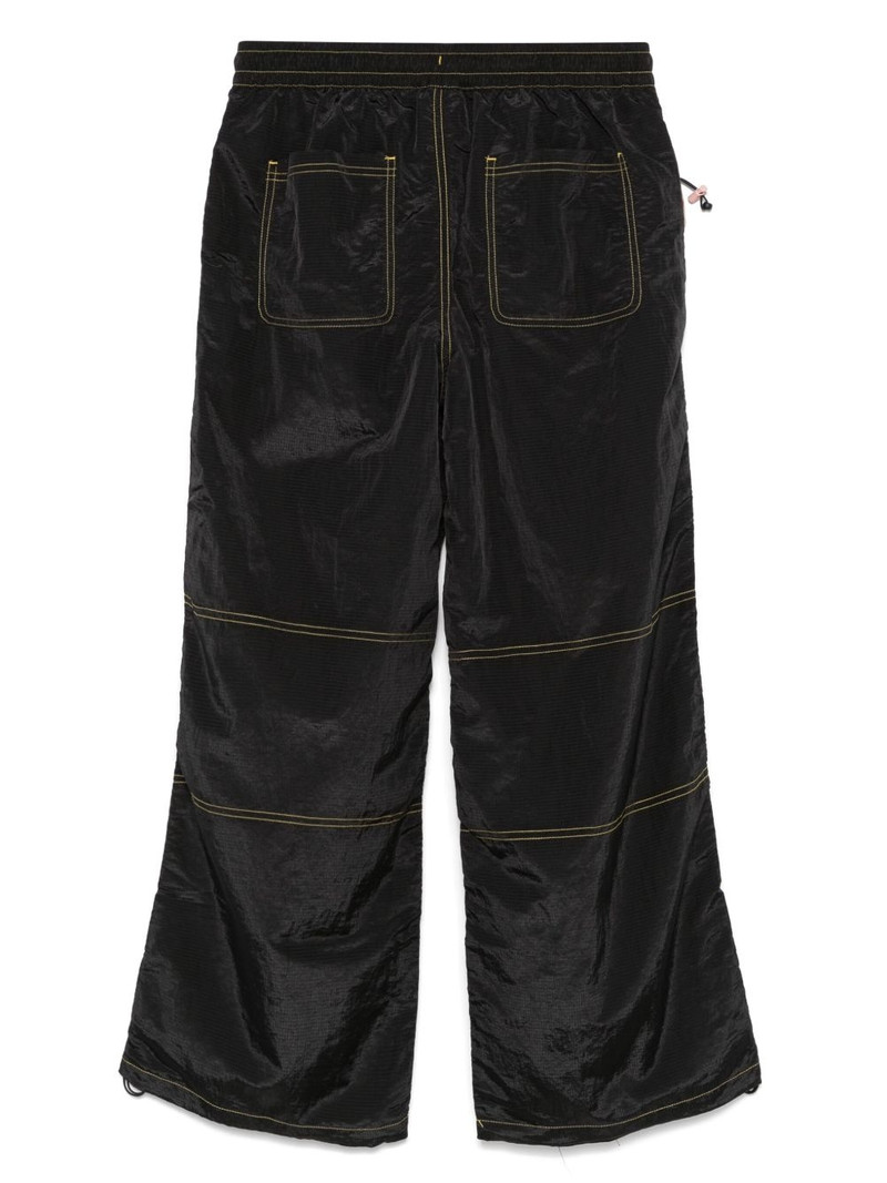 PUMA x KidSuper logo-print trousers outlook