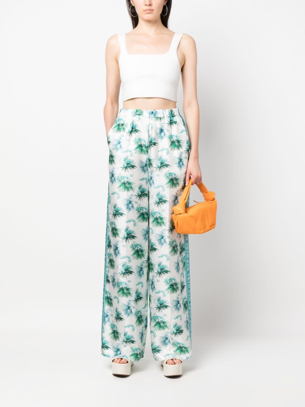 all-over graphic-print trousers - 2