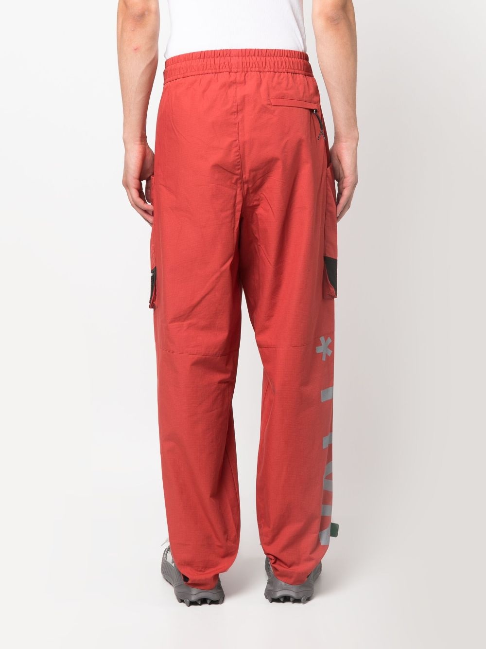Overset Tech logo-print trousers - 4