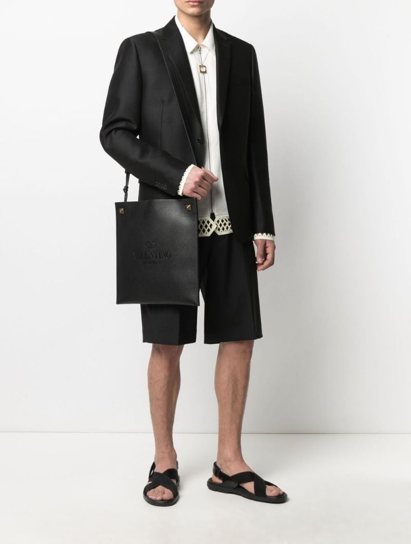 【VALENTINO】 Logo-Embossed Messenger Bag Valentino logo-embossed messenger bag | farfetch | REVERSIBLE