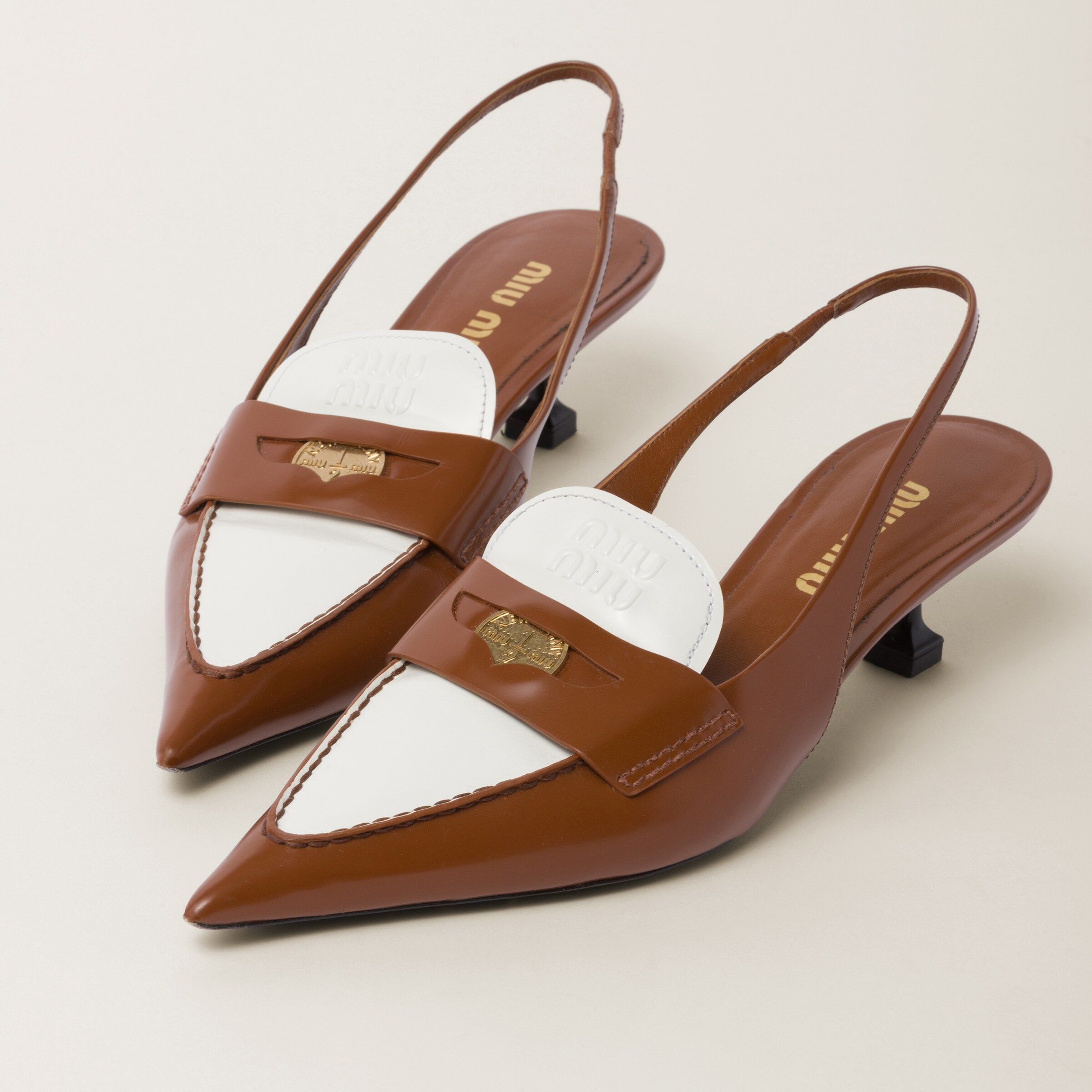 Miu Miu Leather penny loafers with heel | REVERSIBLE