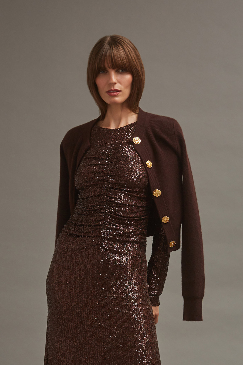 Cara Cara Ellery Cardigan
A Timeless Wardrobe Staple with Elegant Gold Floral Buttons outlook