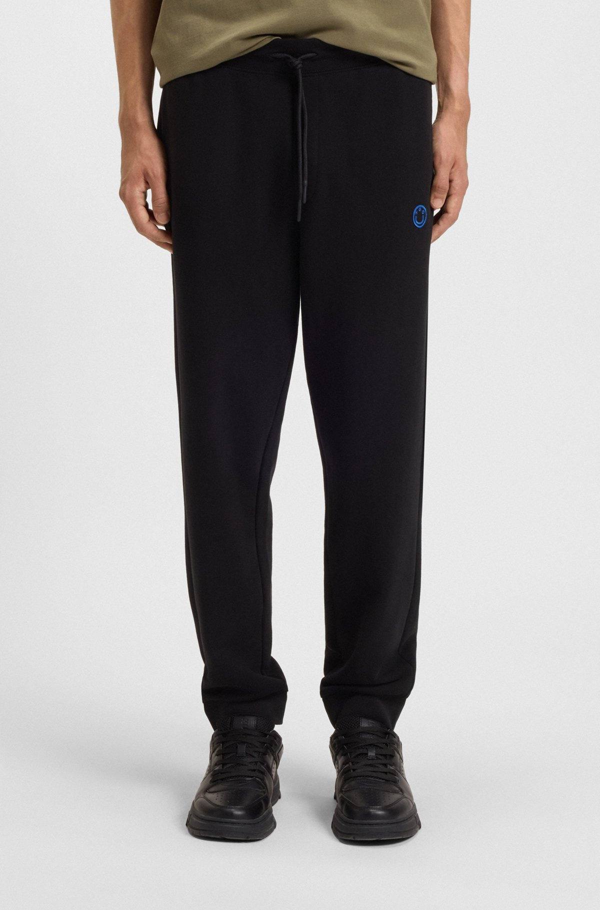 COTTON-TERRY TRACKSUIT BOTTOMS WITH HAPPY HUGO LOGO PATCH - 2