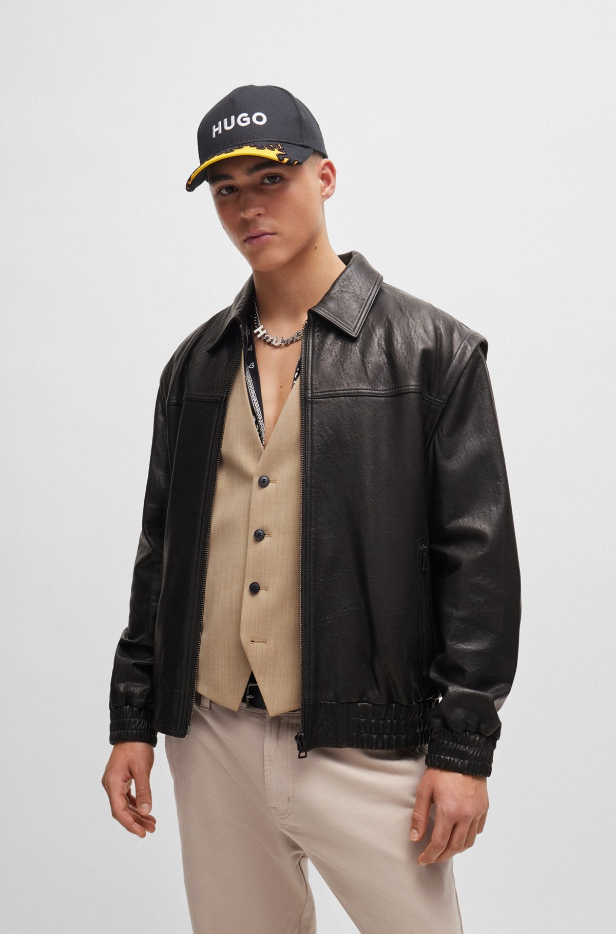 LEATHER JACKET WITH DETACHABLE SLEEVES AND STUD ARTWORK - 2