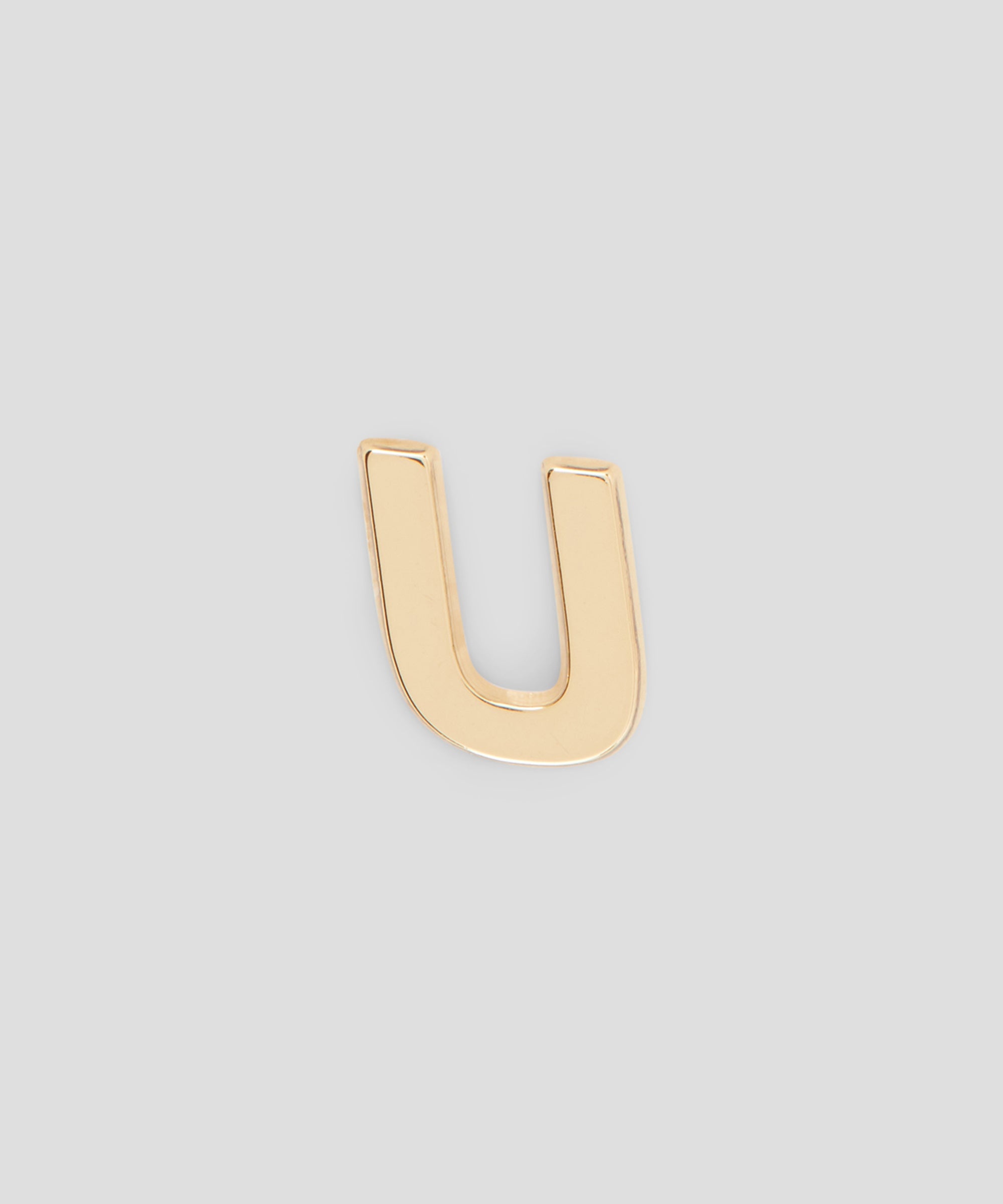 Single brass U charm - 1