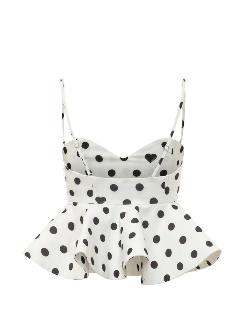 FIORUCCI polka-dot peplum top outlook