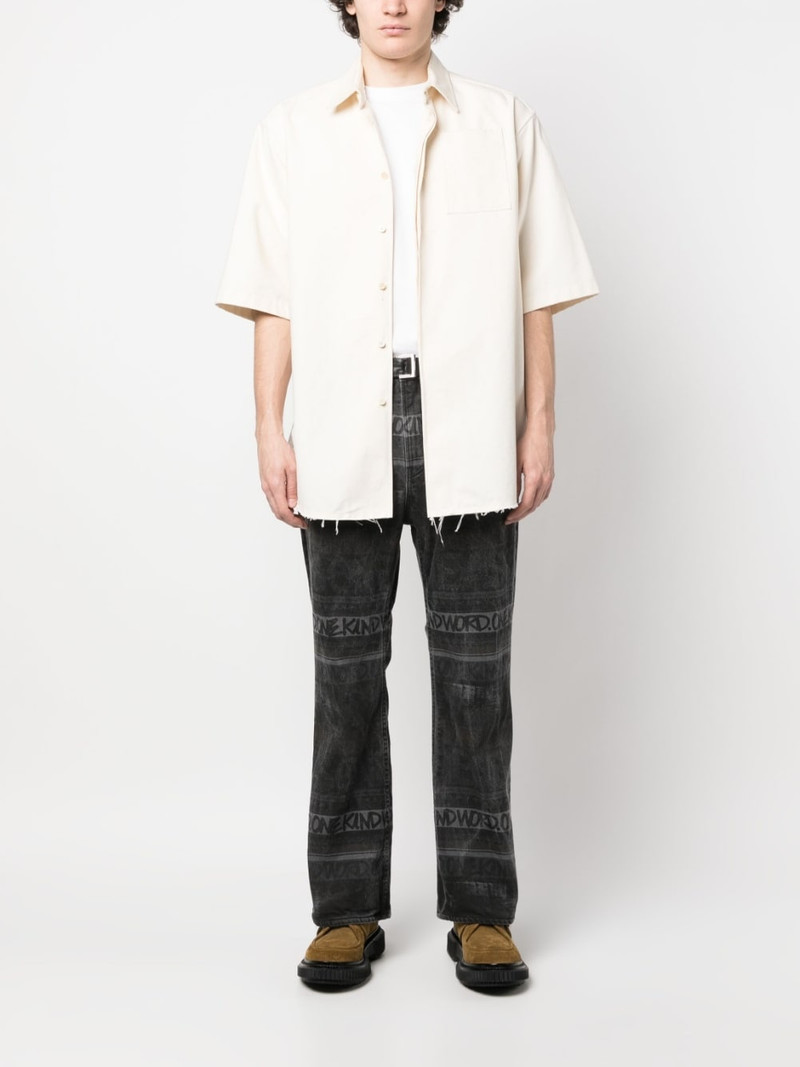 sacai logo-pattern denim jeans outlook