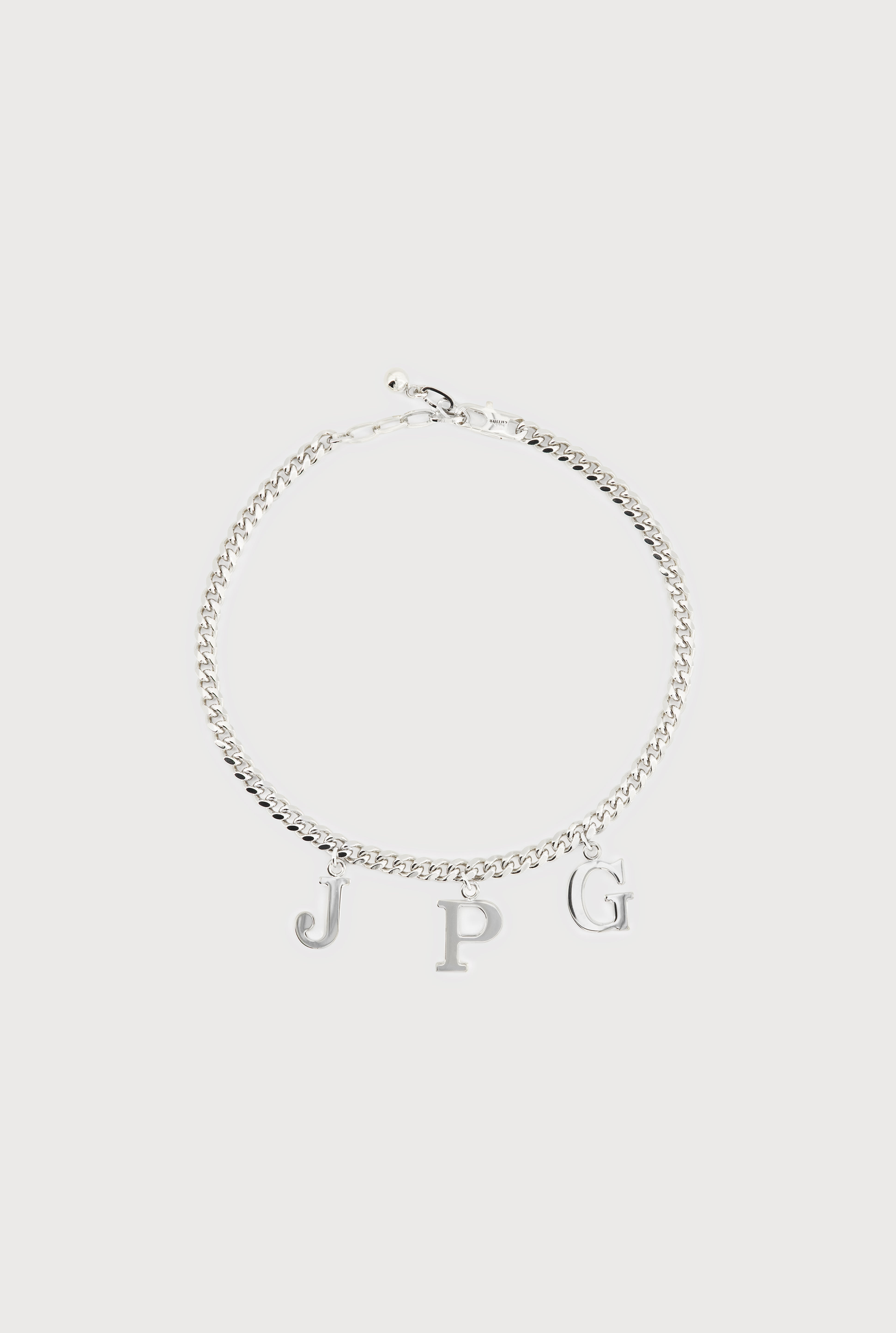 THE SILVER-TONE “JPG” NECKLACE - 1