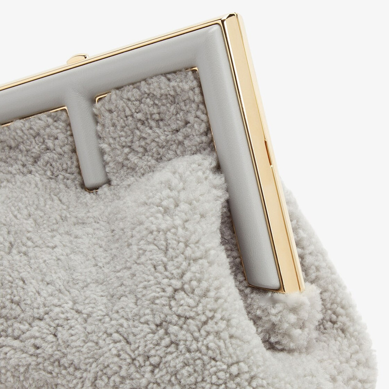 Small Fendi First bag made of soft, pale gray sheepskin with oversized metal F clasp bound in tone o 5