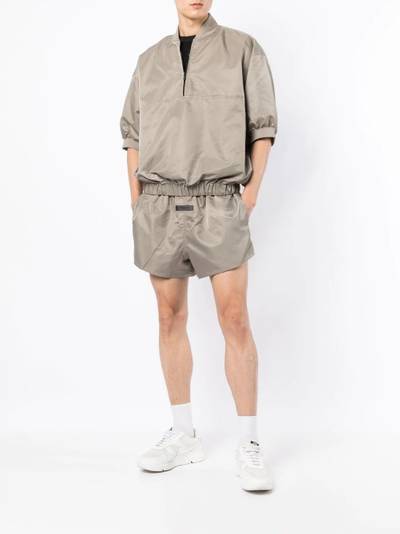 ESSENTIALS half-zip short-sleeve techical pullover outlook