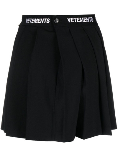 VETEMENTS logo-waistband pleated skirt outlook