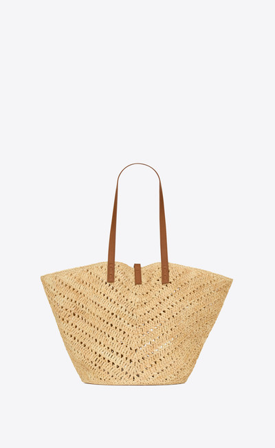 SAINT LAURENT panier medium in raffia and vegetable-tanned leather outlook