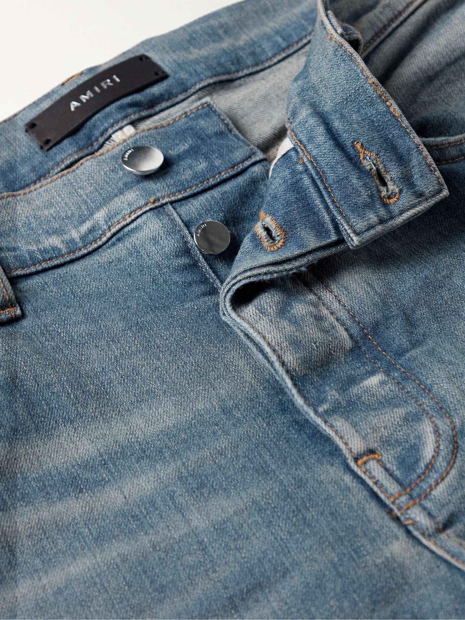AMIRI MX1 Skinny-Fit Ultrasuede®-Panelled Distressed Jeans AMIRI MX1 Skinny-Fit Ultrasuede®-Panelled Distressed Jeans