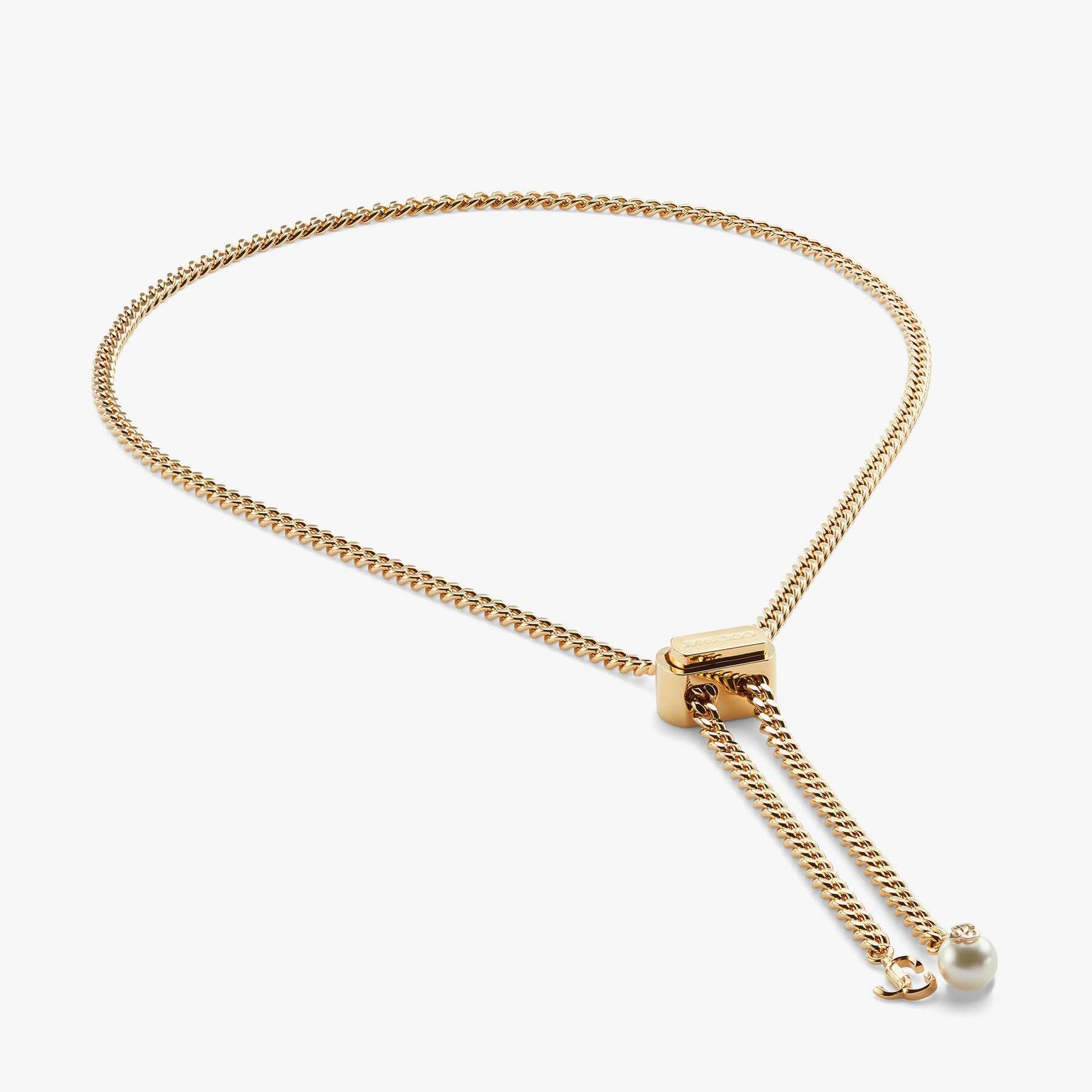 Bon Bon Necklace
Gold-Finish Metal Necklace with Pearl and JC Charm - 3