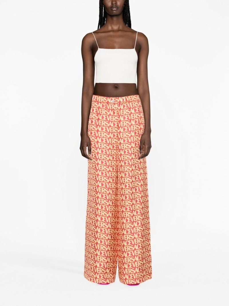 VERSACE logo-print silk palazzo pants outlook