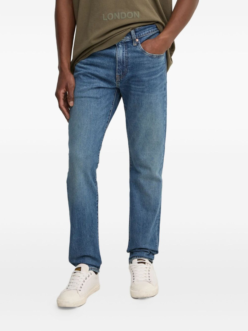 502 logo-patch jeans 1