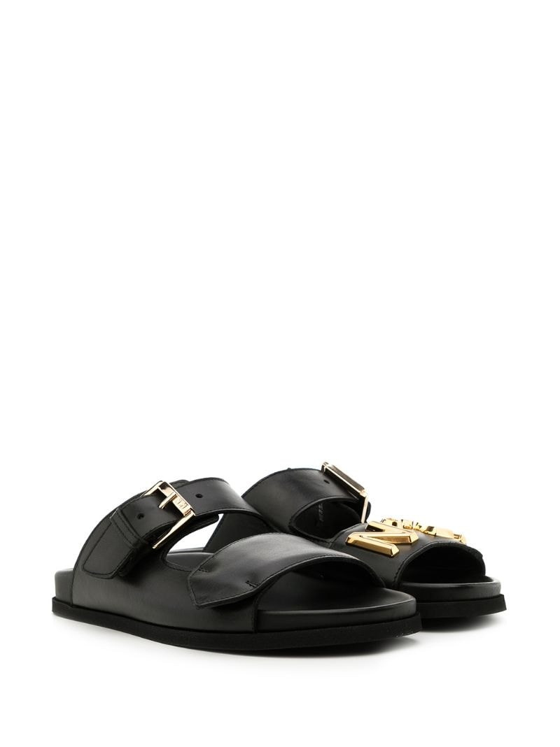 N°21 buckled leather slides outlook