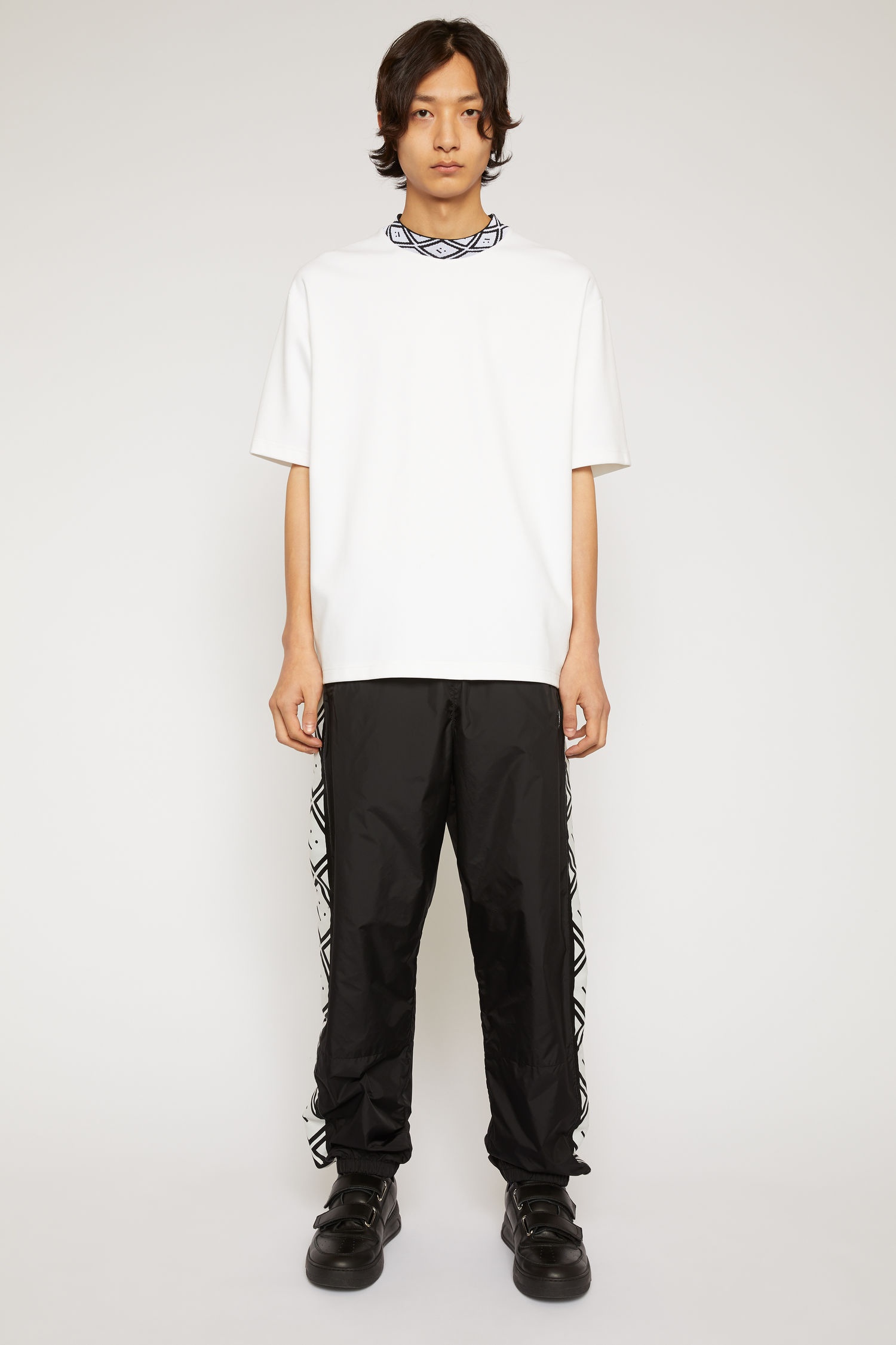 Face motif stripe track pants black - 2