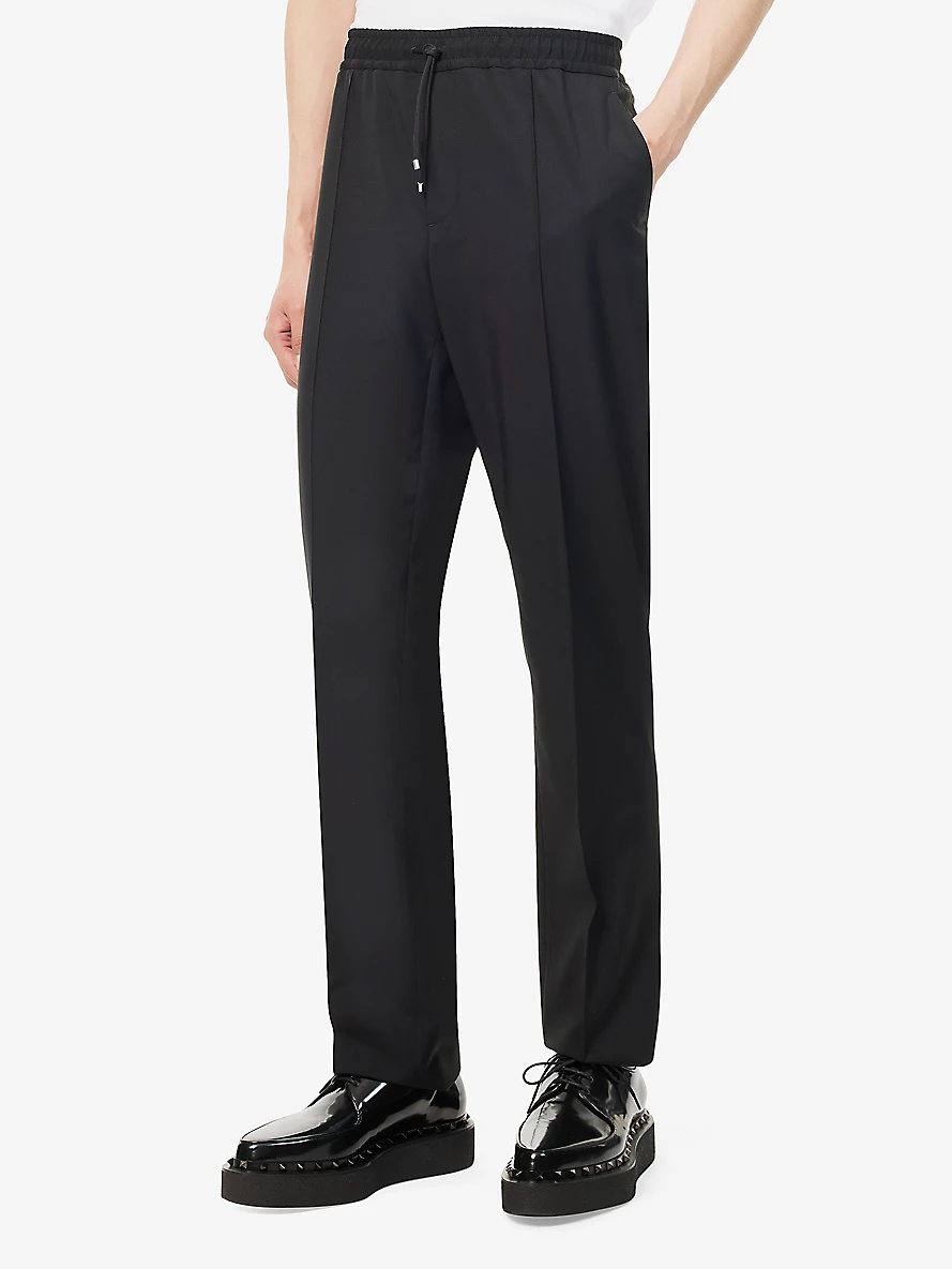 Brand-appliqué tapered-leg wool-blend trousers - 3