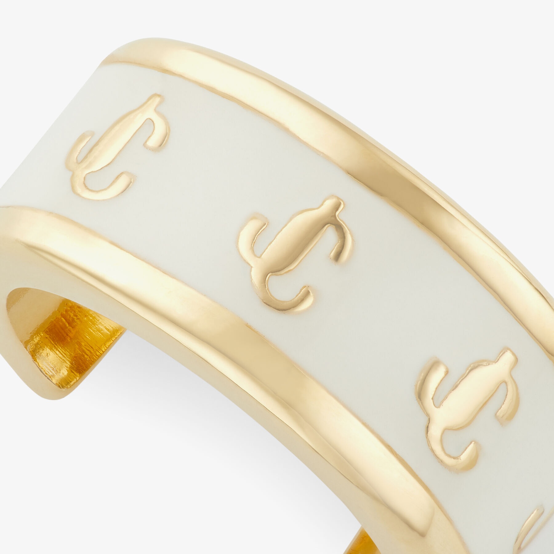 Single JC Ear Cuff
Gold-Finish Metal and Latte Enamel JC Ear Cuff - 5