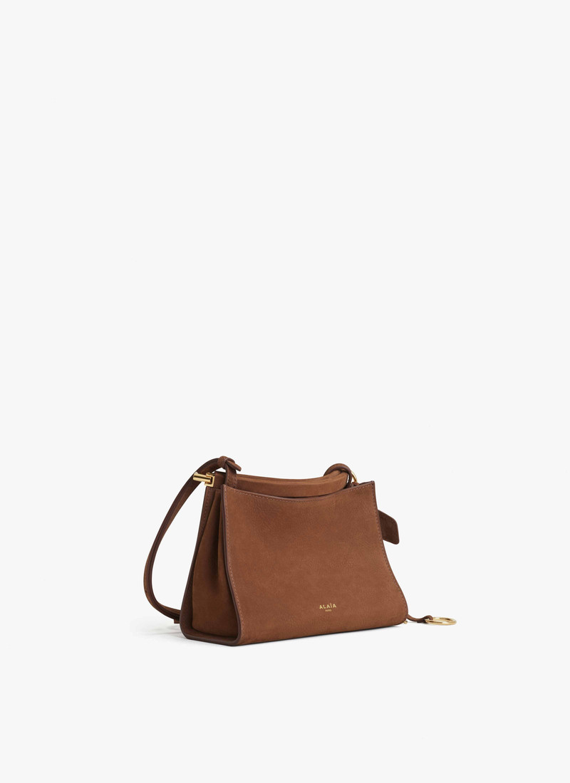 Alaïa LE CLICK SMALL SQUARE BAG IN NUBUCK outlook