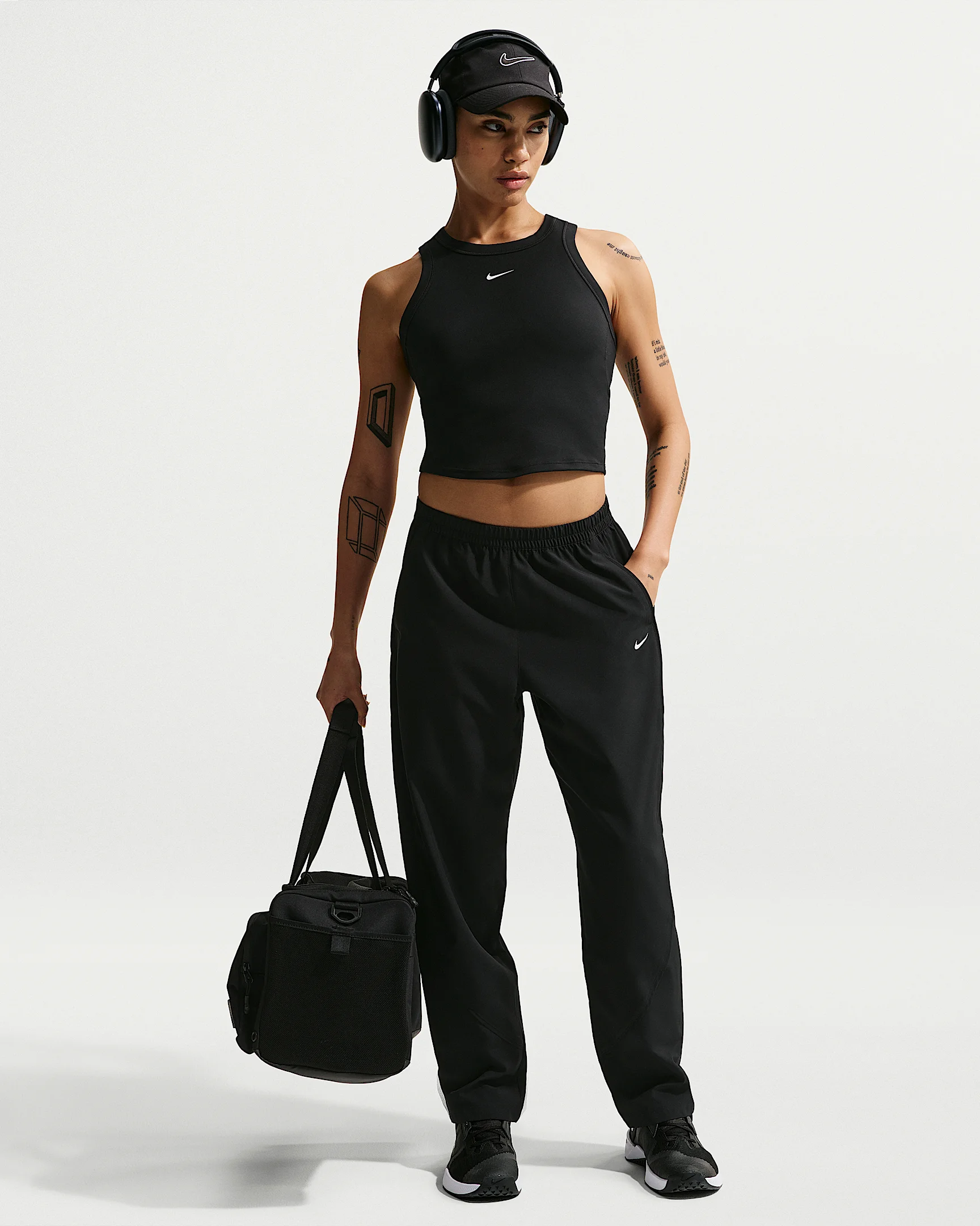 Nike One Women's Dri-FIT Mid-Rise Woven Pants - 1