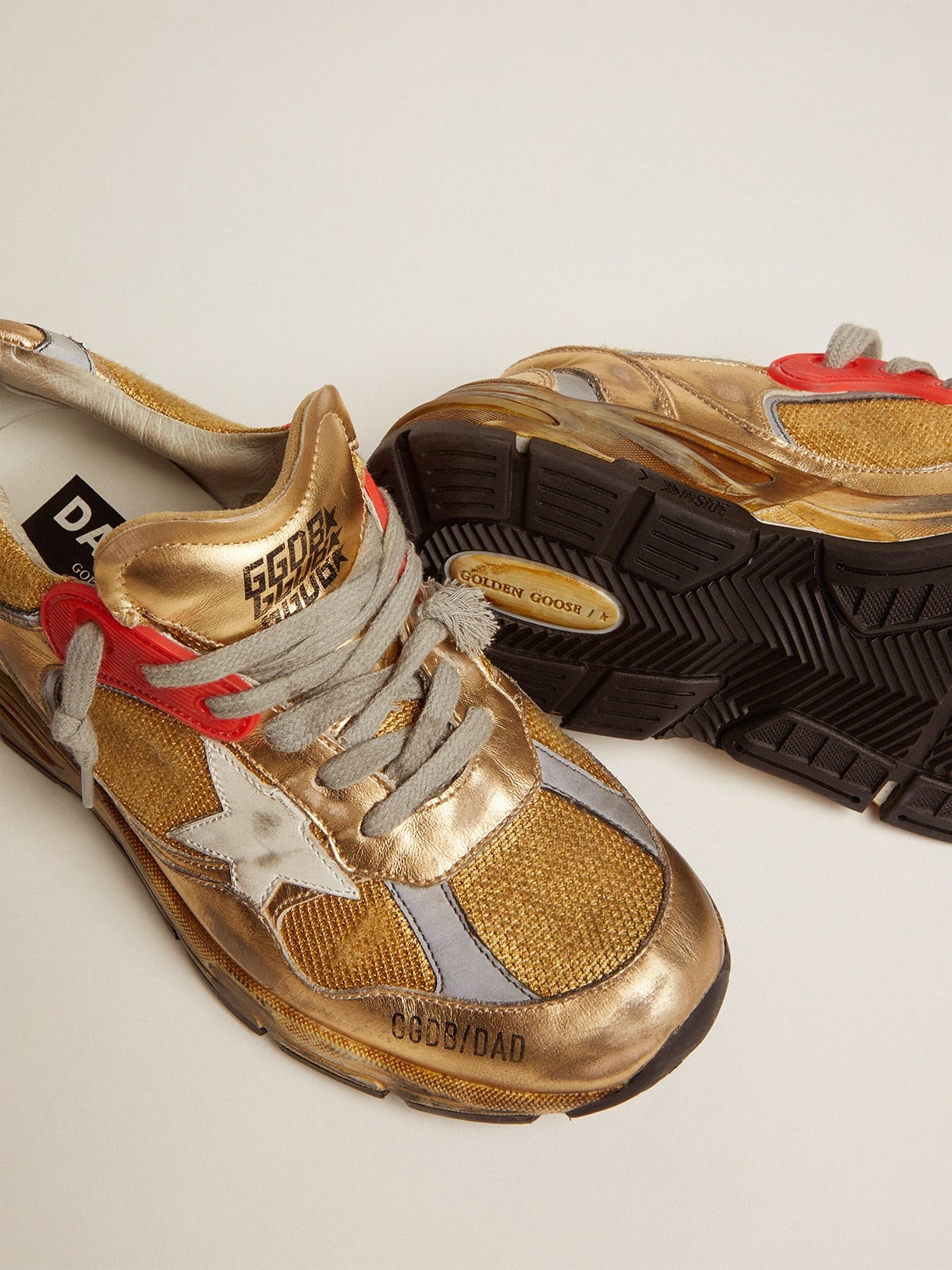 Golden Goose Women's gold Dad-Star sneakers | REVERSIBLE