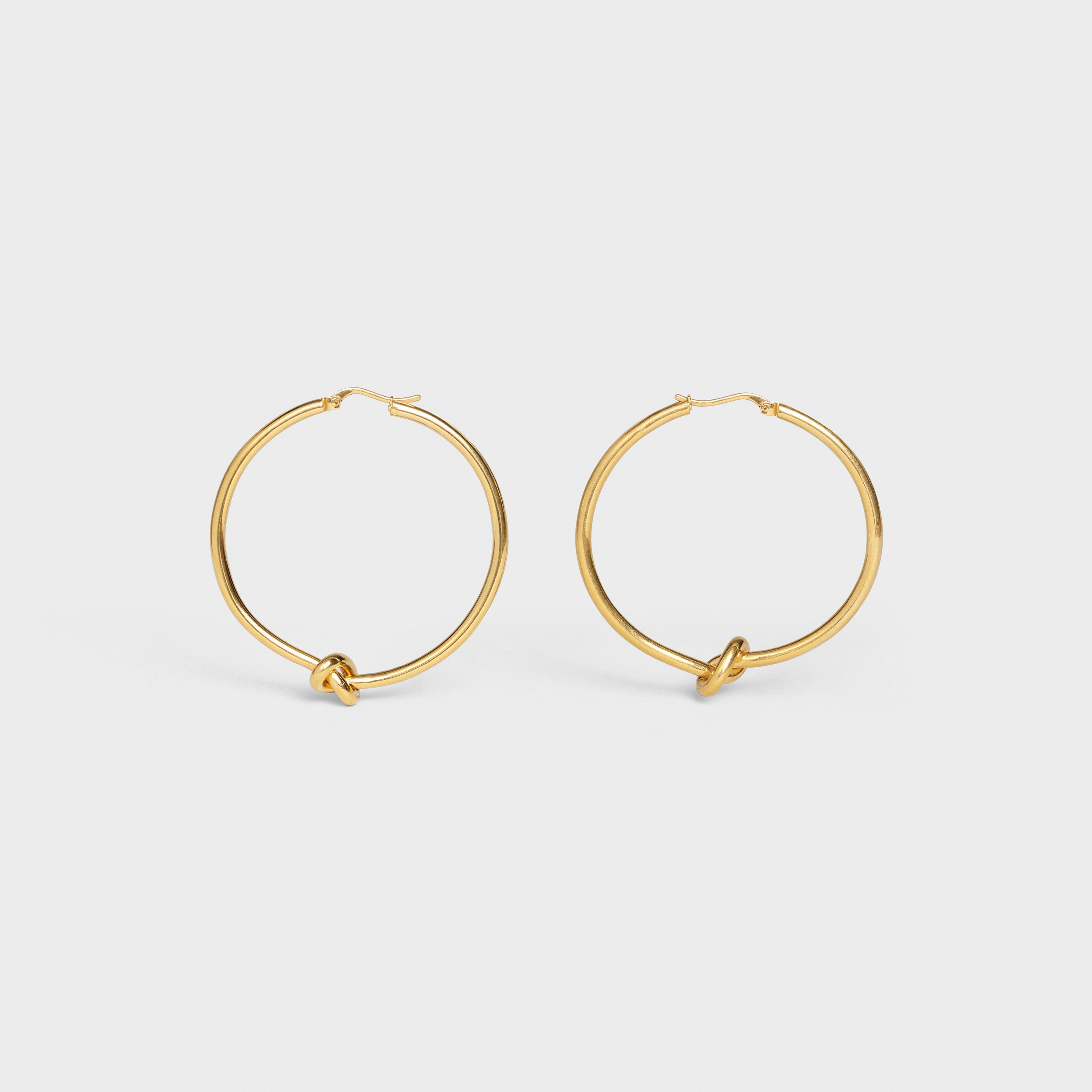 KNOT LARGE HOOPS IN BRASS WITH GOLD FINISH - 1