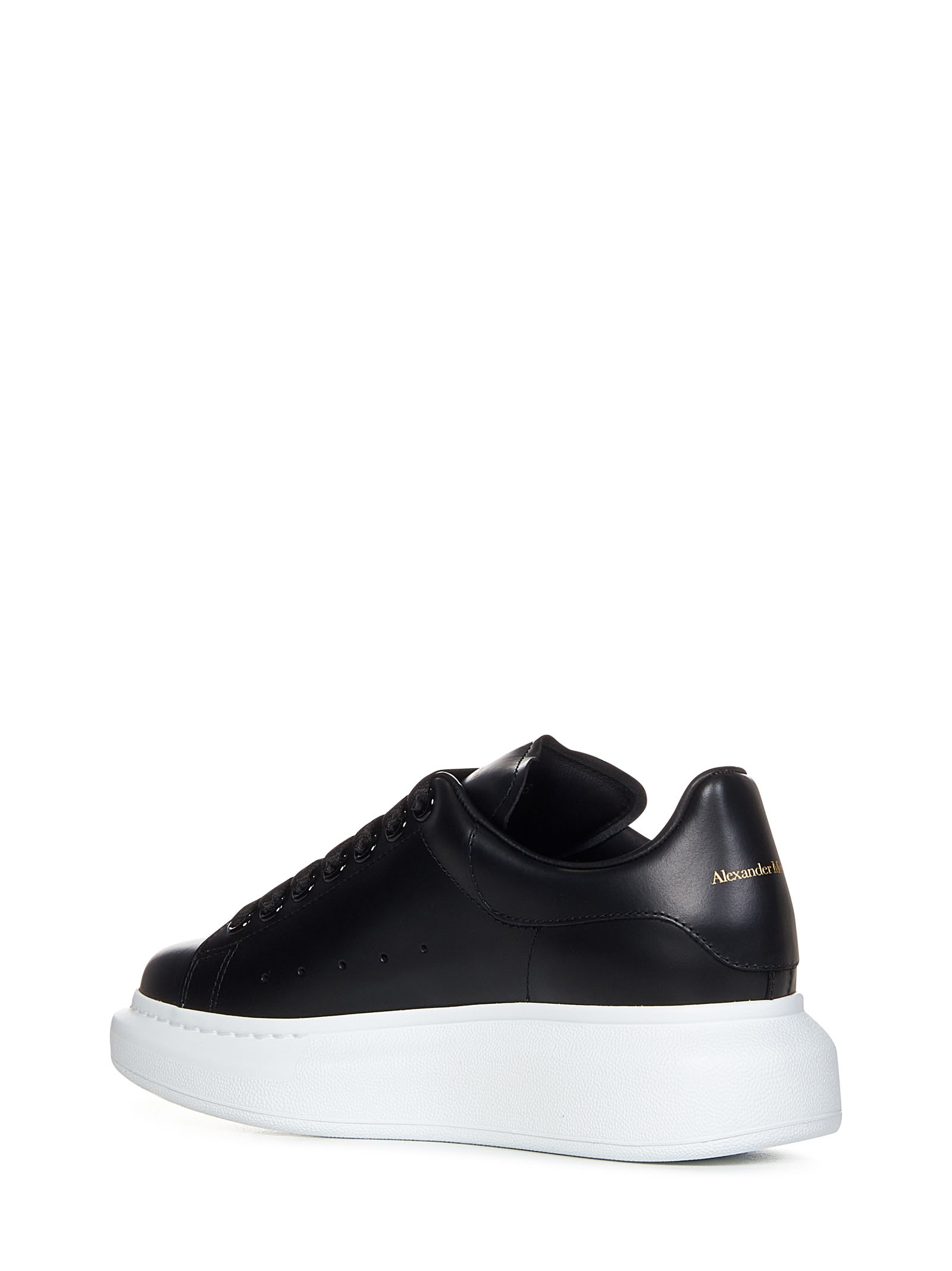 Black sneakers in smooth calfskin with oversized rubber sole and gold signature. - 3