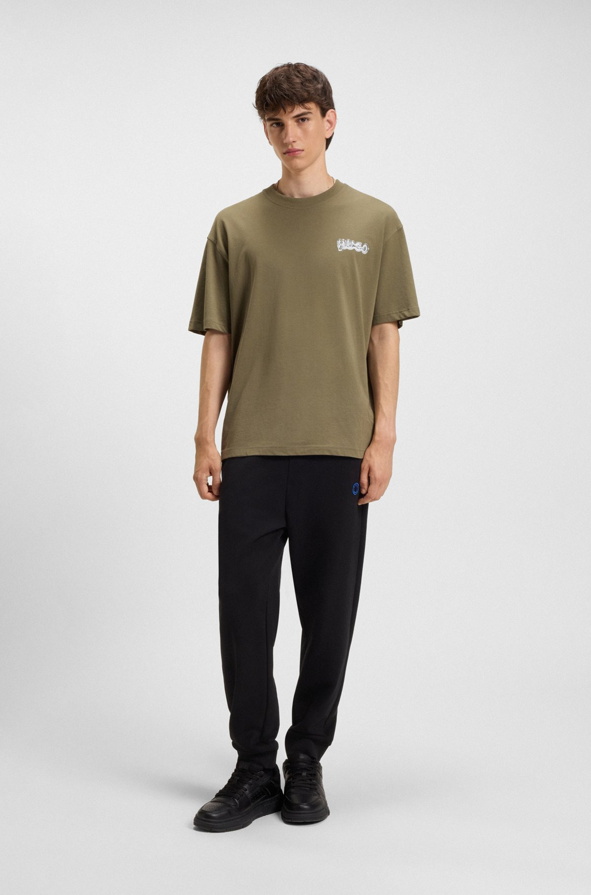 COTTON-TERRY TRACKSUIT BOTTOMS WITH HAPPY HUGO LOGO PATCH - 4
